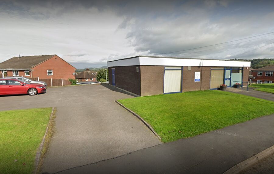 The clinic on Well Street, Biddulph: a single-storey flat-roofed building with its own car park.